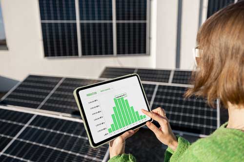 A business person calculating the savings that commercial operators across Albury Wodonga can make by switching to solar power. CJ Power Solutions Albury